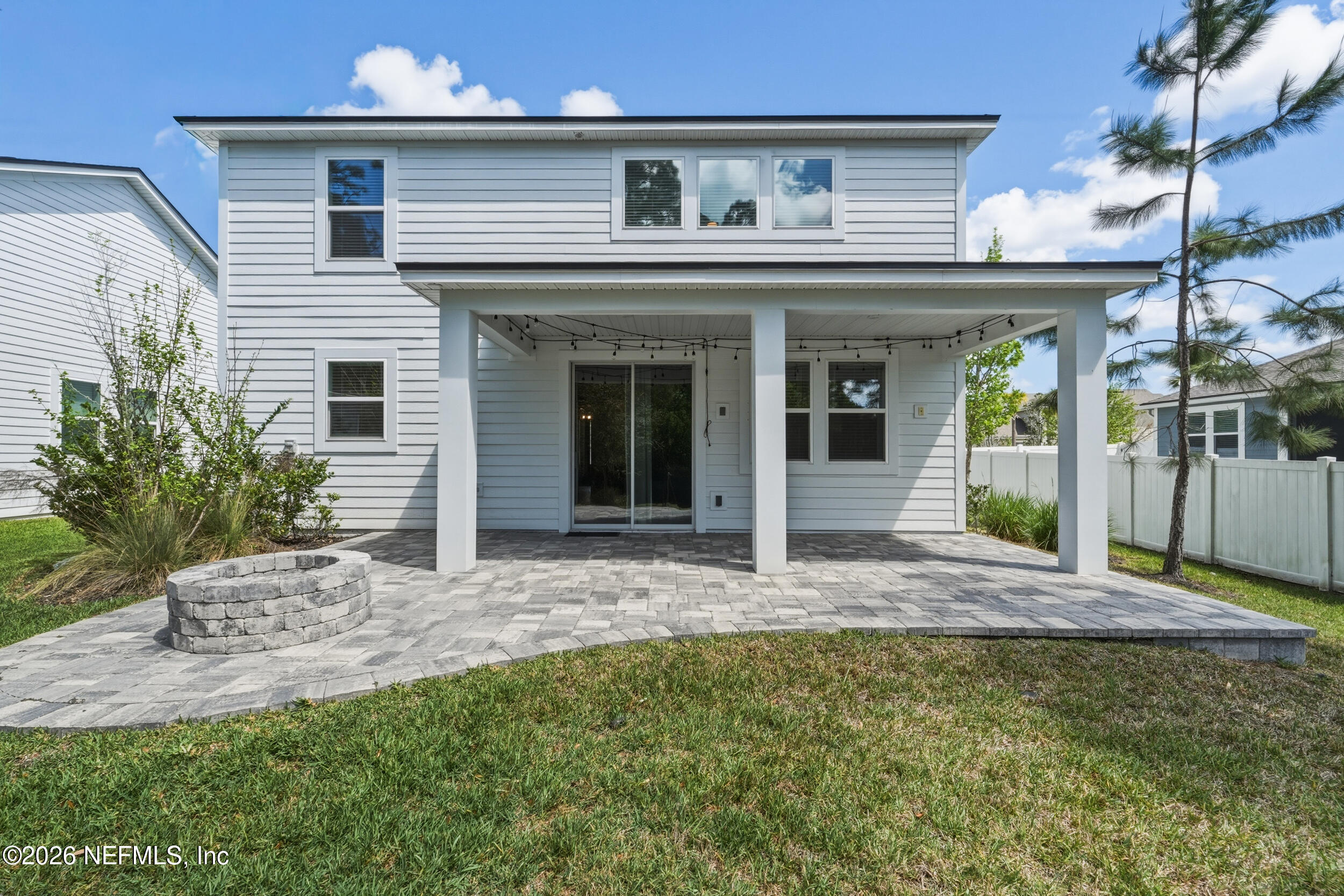 49 Oak Shadow Place St. Johns, FL 32259 - Photo 10 of 48 a view of a house with a porch and floor to ceiling window