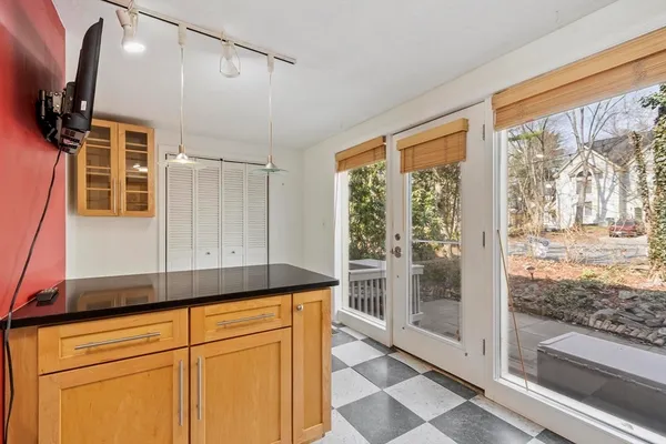 a view of a sink and dishwasher with wooden floor