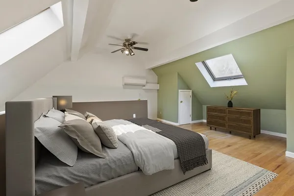 a bedroom with a bed and a table