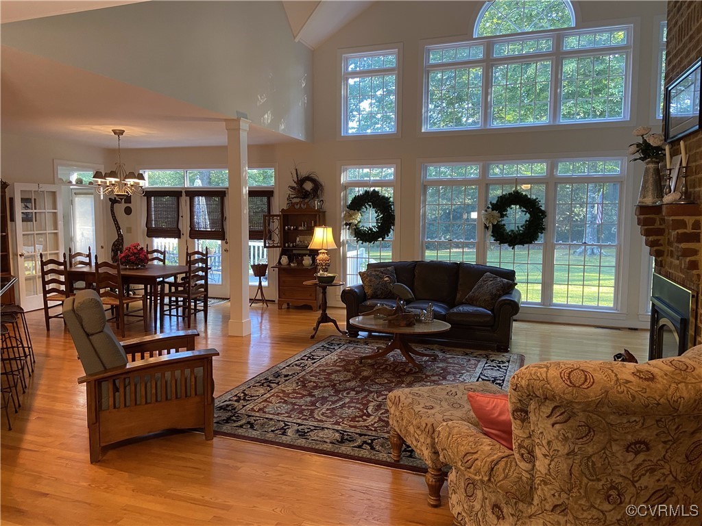 403 Woodruff Drive Aylett, VA 23009 - Photo 17 of 33 Living room with a notable chandelier, a high ceil