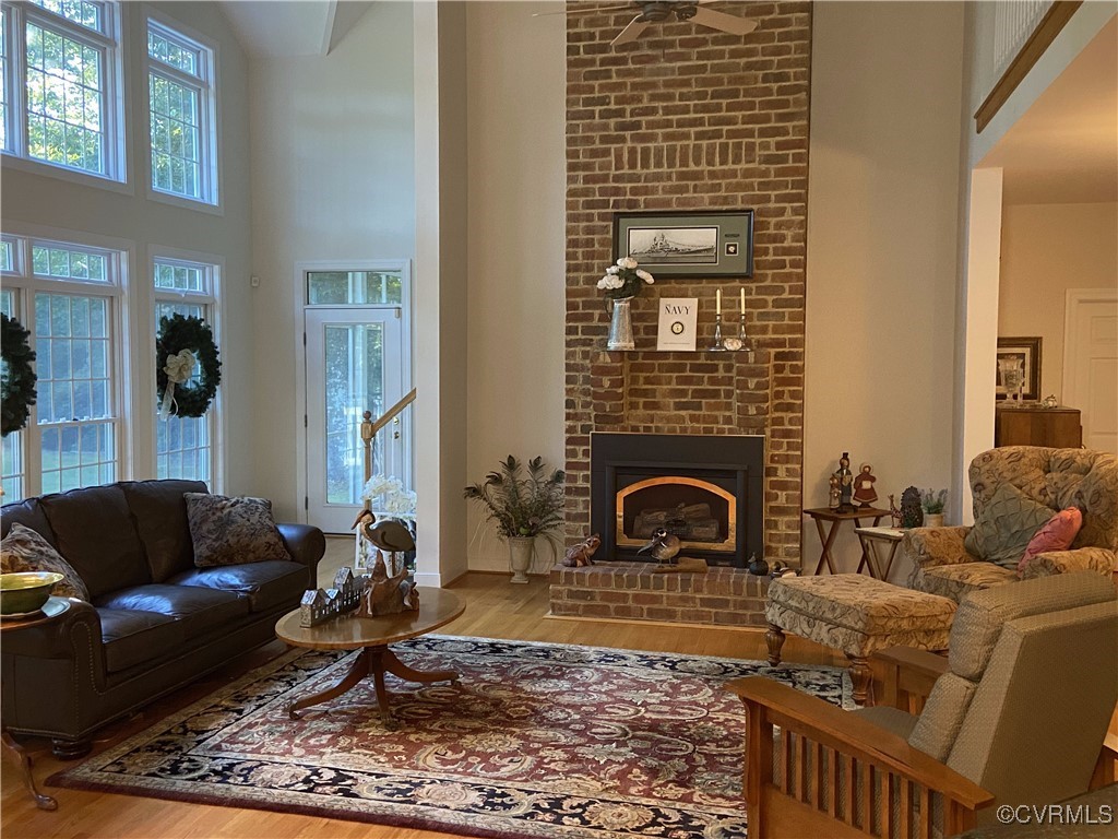 403 Woodruff Drive Aylett, VA 23009 - Photo 18 of 33 Living room featuring a towering ceiling, hardwood
