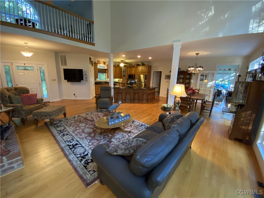 403 Woodruff Drive Aylett, VA 23009 - Photo 20 of 33 Living room with a towering ceiling, light hardwoo