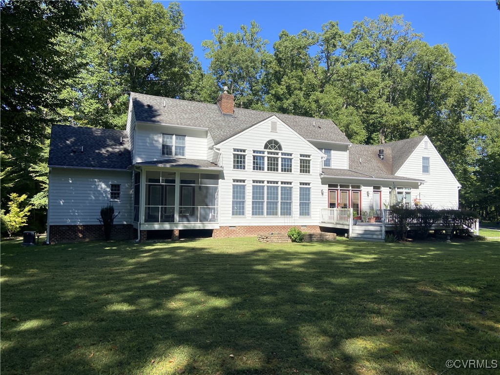 403 Woodruff Drive Aylett, VA 23009 - Photo 2 of 33 Back of house with a deck, a lawn, and a sunroom