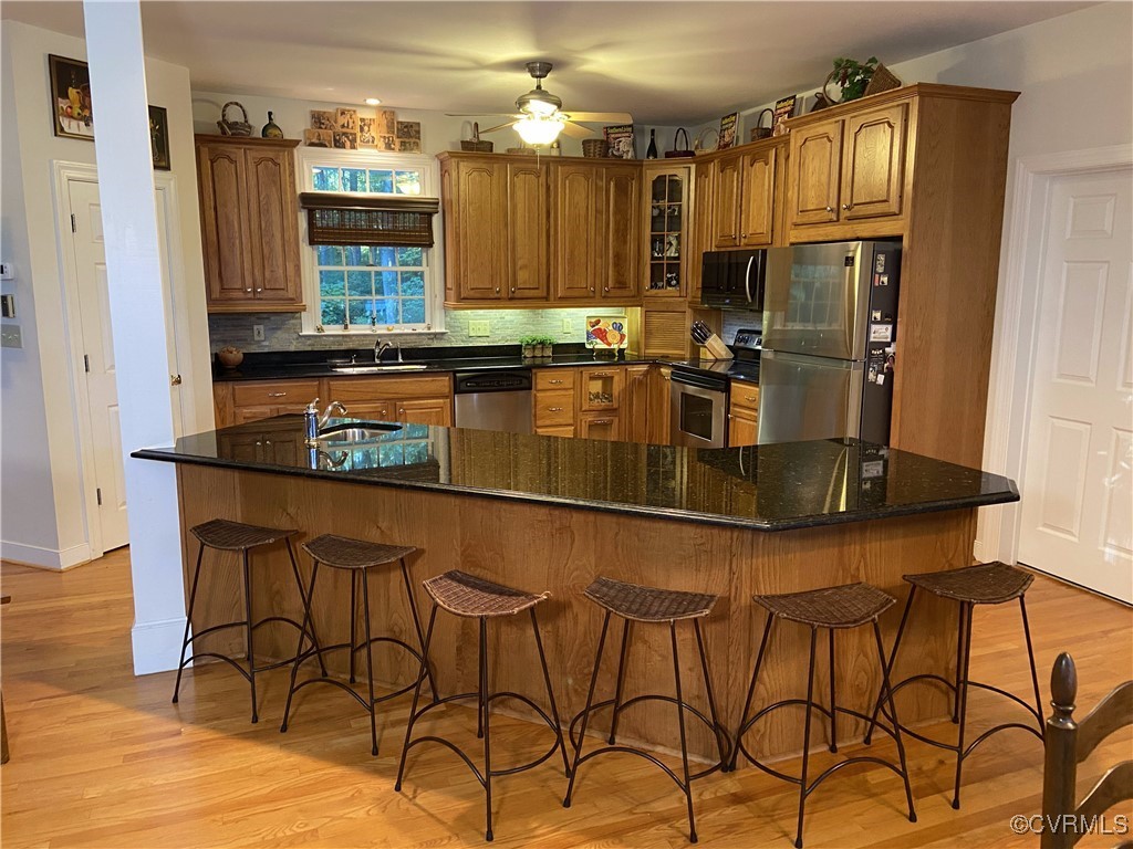403 Woodruff Drive Aylett, VA 23009 - Photo 9 of 33 Kitchen featuring a kitchen island with sink, ligh