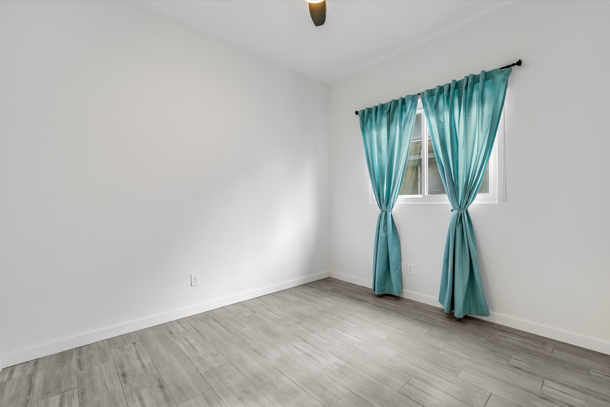 10203 Brantley Bend Austin, TX 78748 - Photo 14 of 20 Empty room with light wood-style floors and a ceiling fan