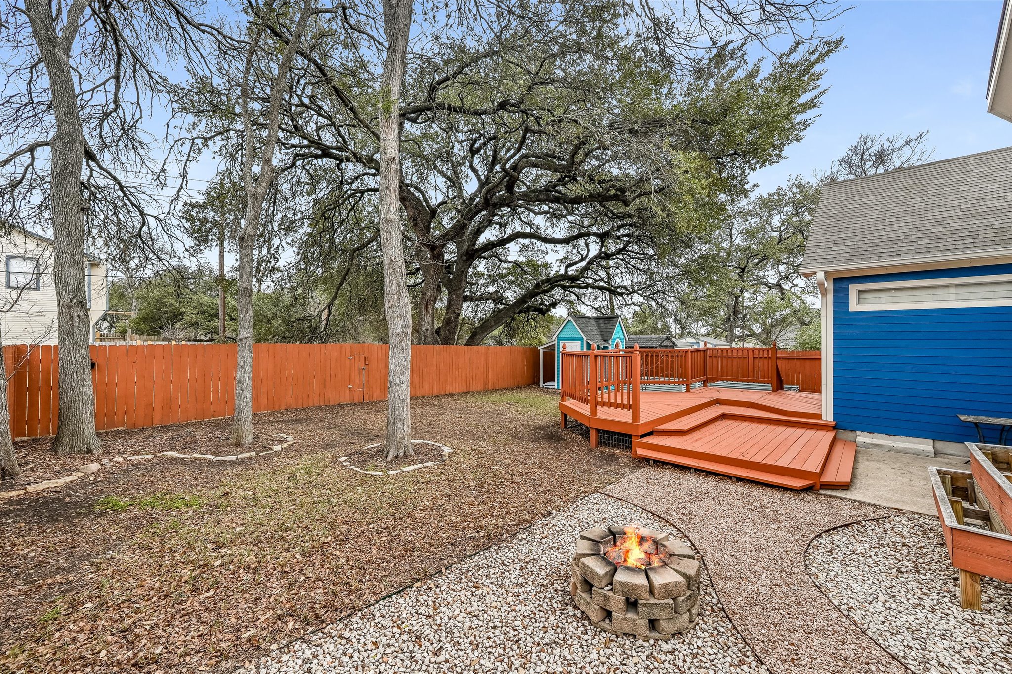 10203 Brantley Bend Austin, TX 78748 - Photo 18 of 20 Fenced backyard featuring a wooden deck and a fire pit