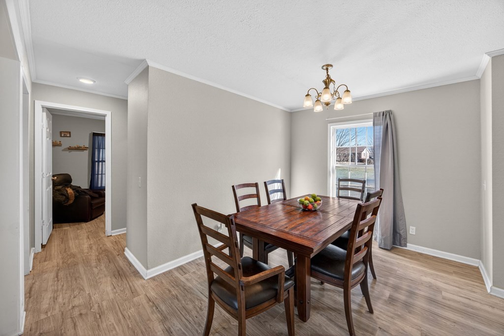 308 Allen's Chapel Road Smithville, TN 37166 - Photo 11 of 26 a view of a dining room with furniture and wooden floor