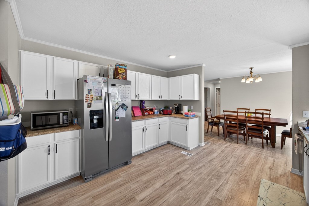 308 Allen's Chapel Road Smithville, TN 37166 - Photo 13 of 26 a kitchen with cabinets and wooden floor