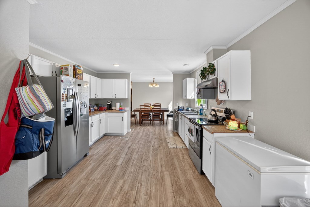 308 Allen's Chapel Road Smithville, TN 37166 - Photo 14 of 26 a kitchen with cabinets and wooden floor