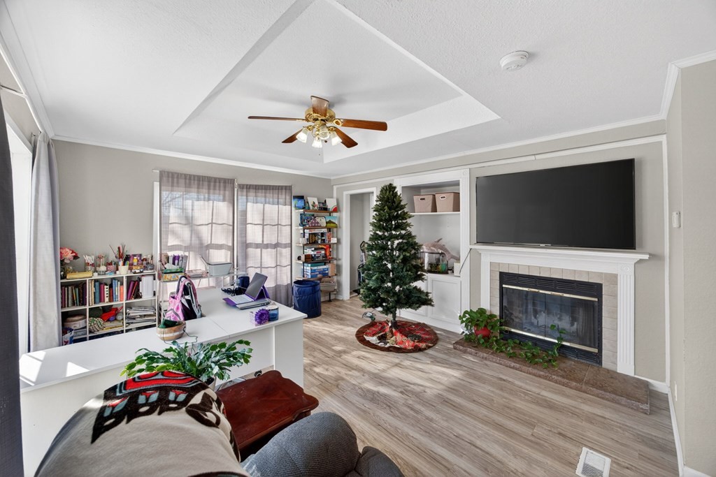 308 Allen's Chapel Road Smithville, TN 37166 - Photo 15 of 26 a living room with furniture a flat screen tv and a fireplace