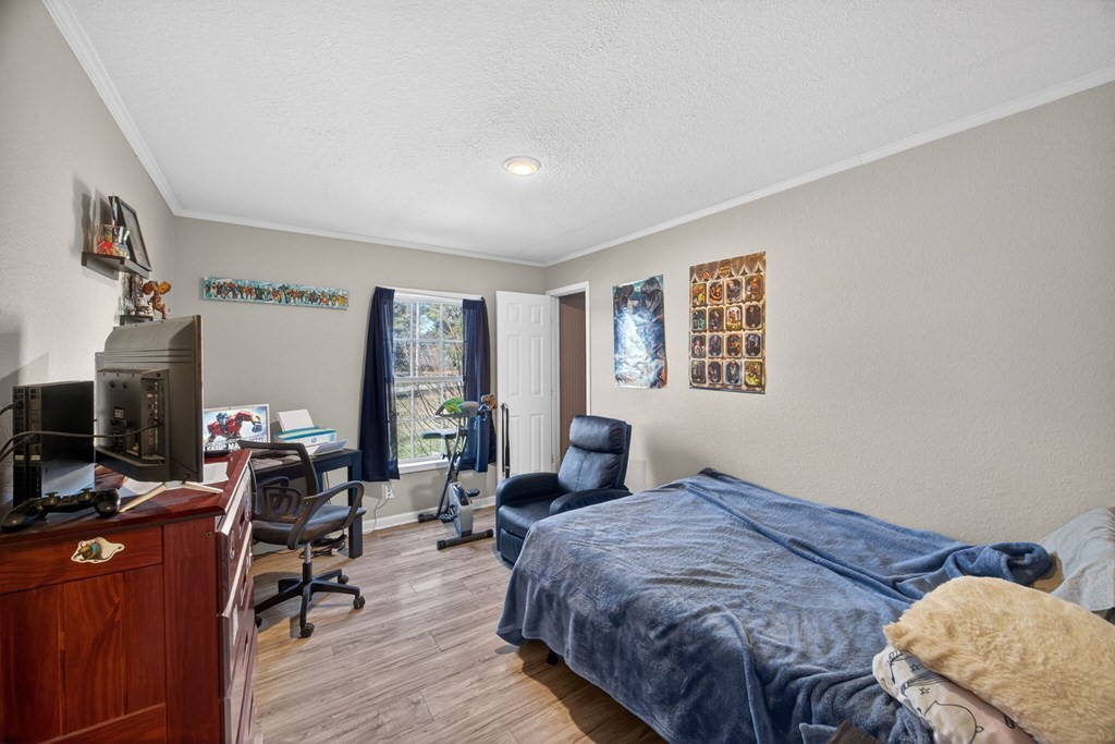 308 Allen's Chapel Road Smithville, TN 37166 - Photo 23 of 26 a bedroom with bed and wooden floor