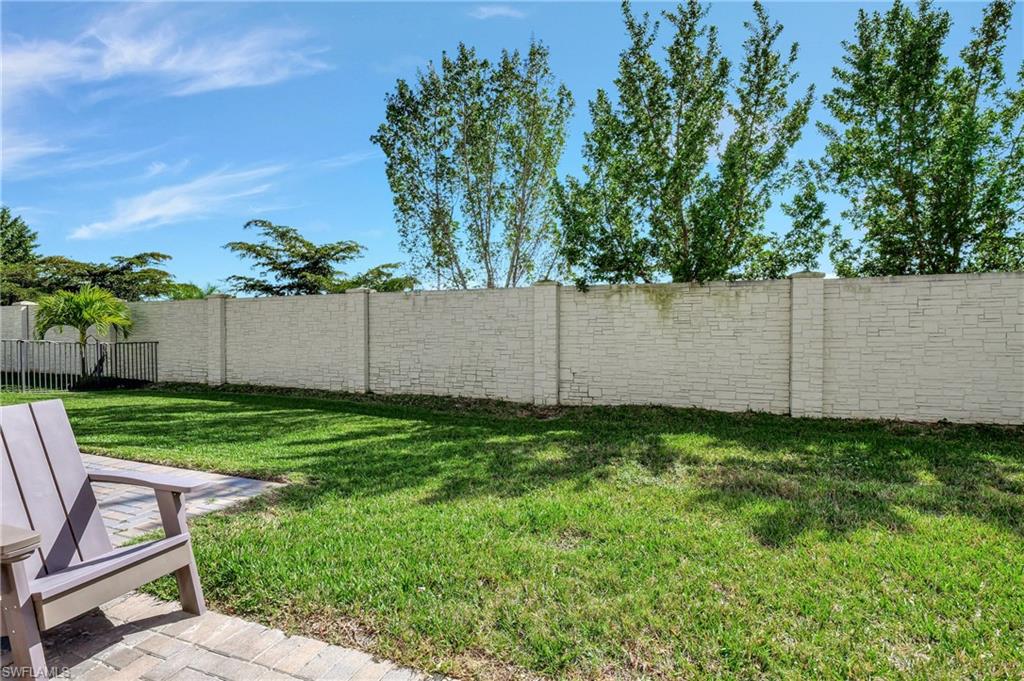 9041 Madrid Circle Naples, FL 34104 - Photo 32 of 32 a view of a backyard