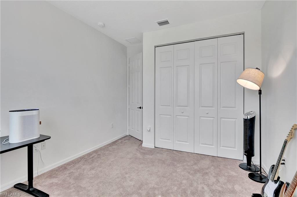 9041 Madrid Circle Naples, FL 34104 - Photo 8 of 32 a view of an empty room