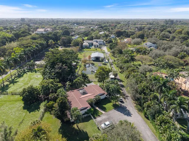 an aerial view of a house with a garden