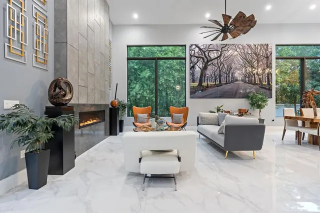 a view of a livingroom with furniture window and wooden floor