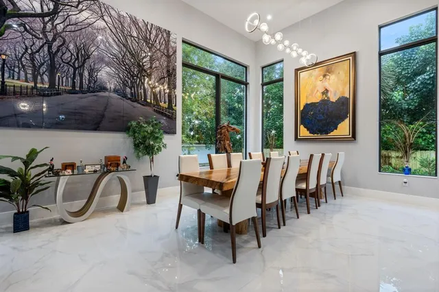 a view of a dining table and chairs in patio