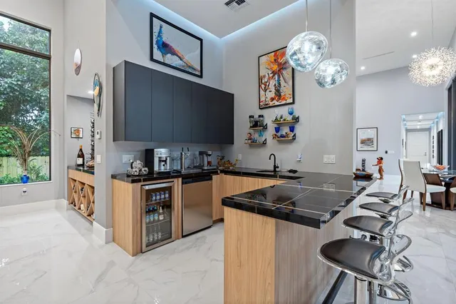 a view of living room with patio furniture and potted plants