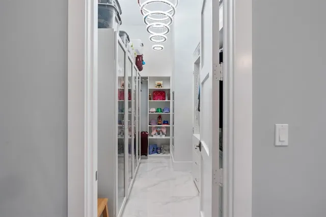 a living room with furniture and a book shelf