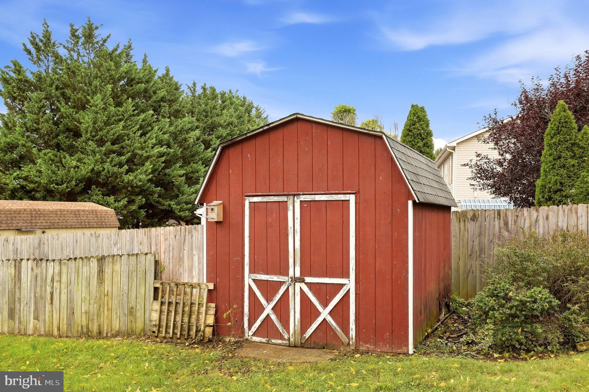175 Pointer Way Inwood, WV 25428 - Photo 60 of 66 Storage with fenced garden area to keep pets out!