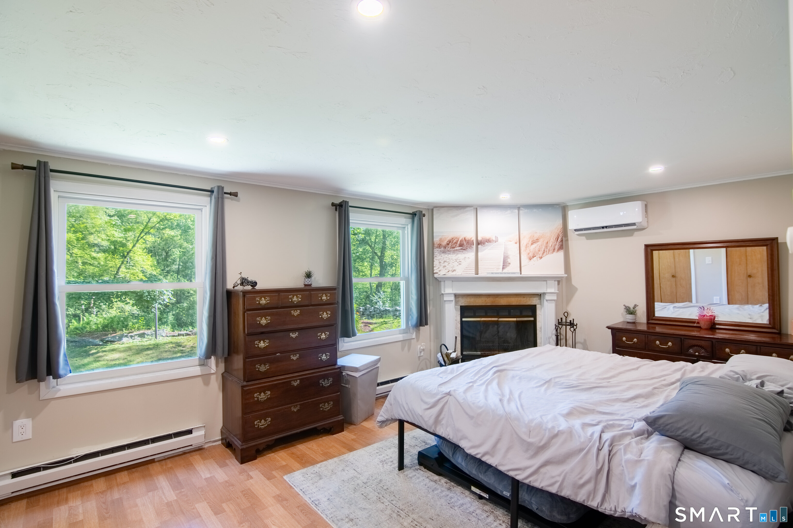 109 Munyan Road Putnam, CT 06260 - Photo 24 of 38 Primary bedroom with fireplace, double closets, on the main level