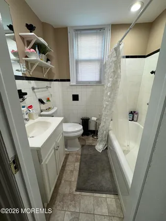 a bathroom with a sink a toilet and bathtub