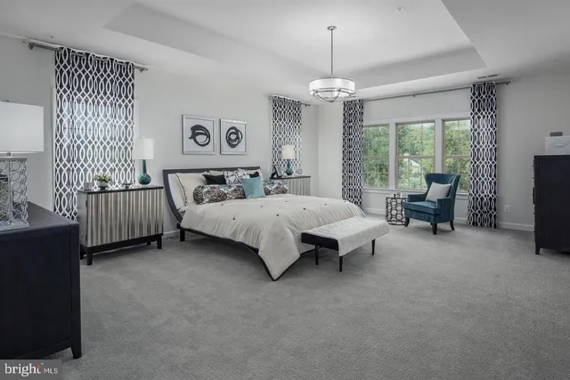 a bed room with a bed and a chandelier