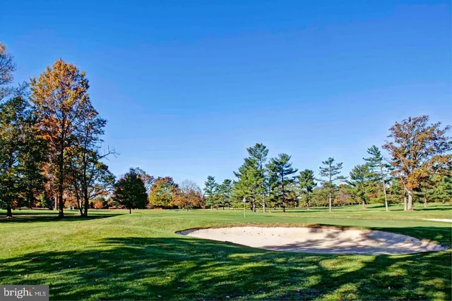 a view of a golf course with a lake