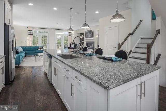 a kitchen with sink and center island