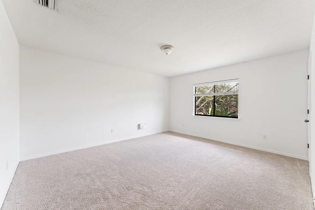 308 Syrah Way St. Augustine, FL 32084 - Photo 14 of 24 an empty room with a bench