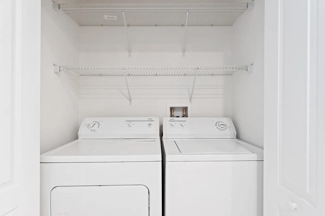 308 Syrah Way St. Augustine, FL 32084 - Photo 16 of 24 a utility room with dryer and washer