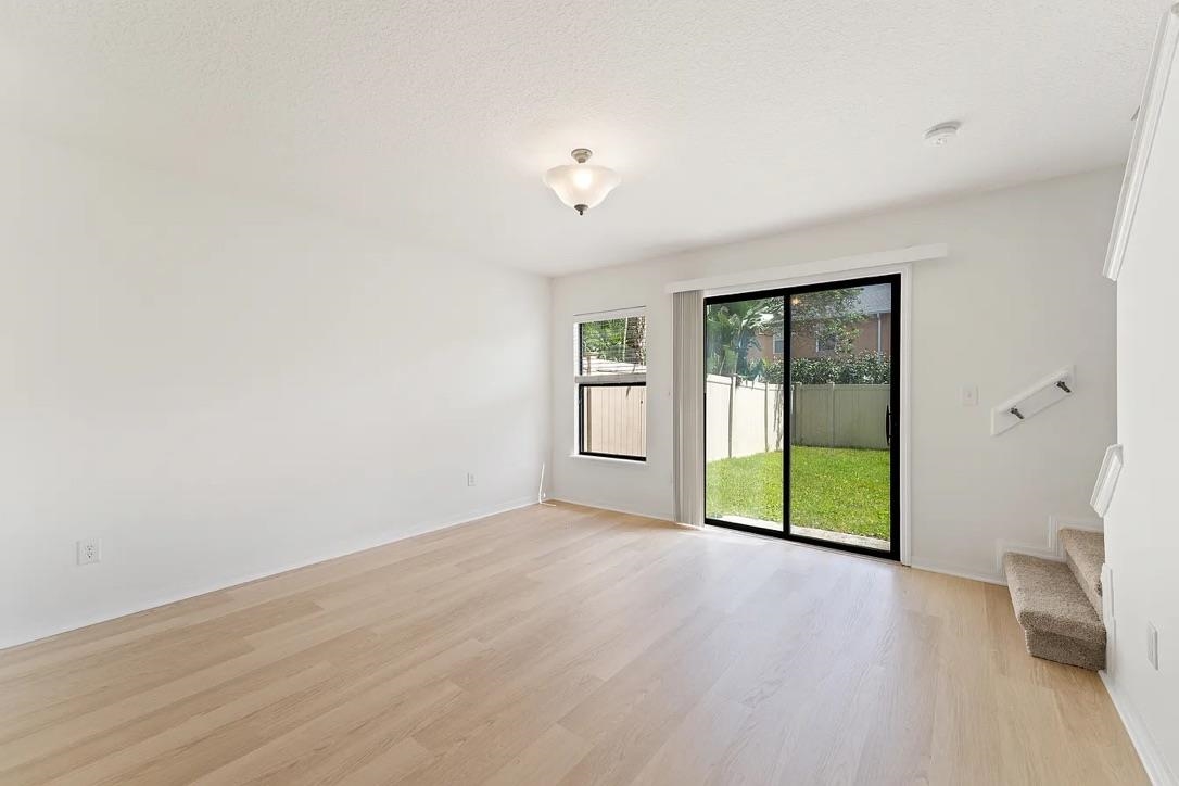 308 Syrah Way St. Augustine, FL 32084 - Photo 6 of 24 wooden floor in an empty room with a window