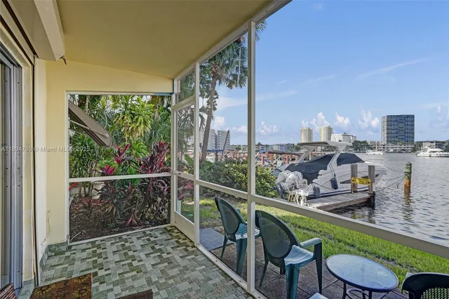 a view of a chairs and table in patio