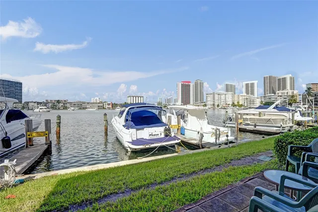 a front view of a house with a yard table and chairs