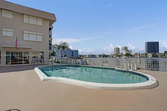a view of a terrace with furniture and lake view