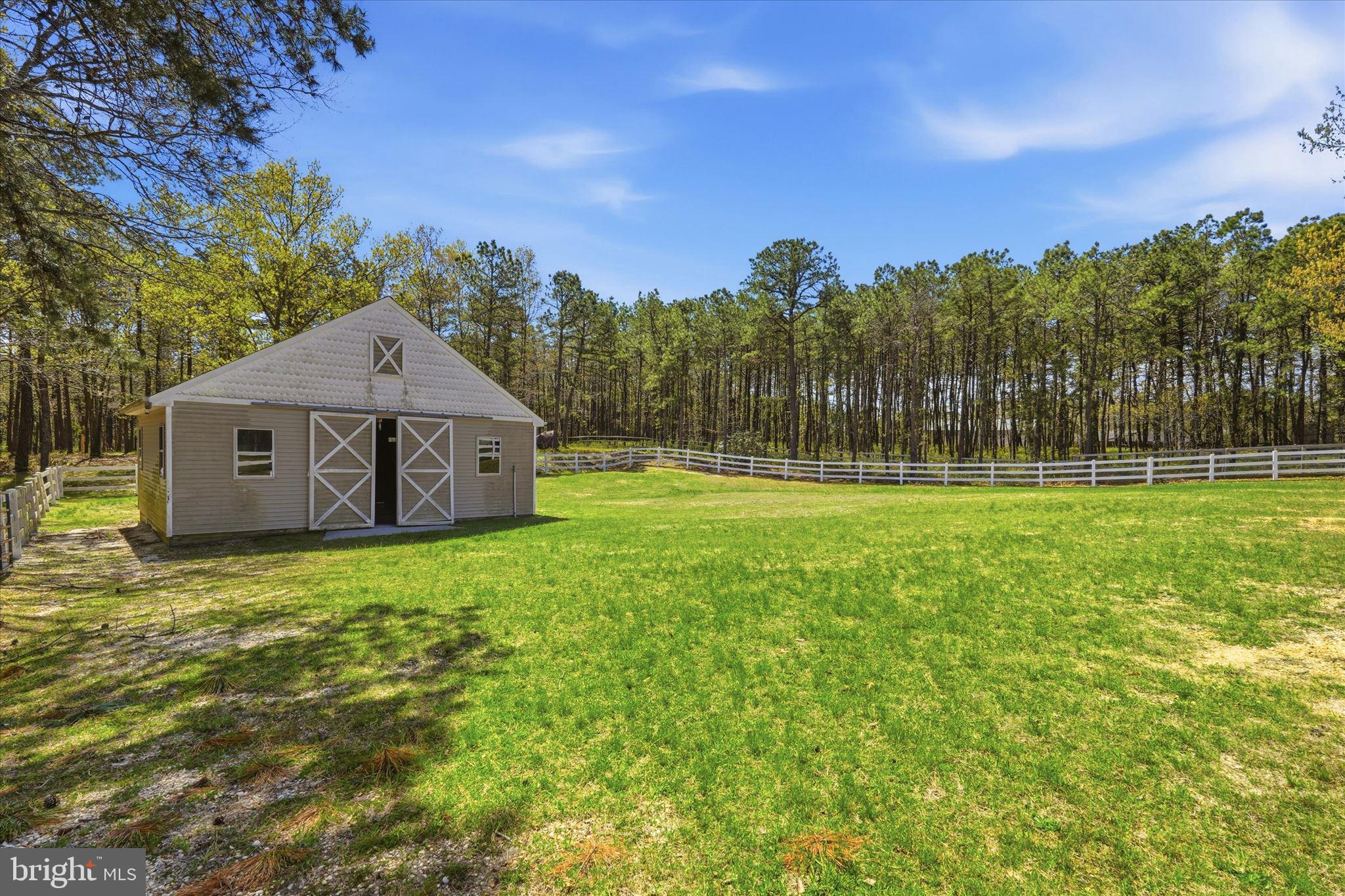 176 Warren Grove Road Barnegat, NJ 08005 - Photo 55 of 71 a front view of a house with a yard and trees