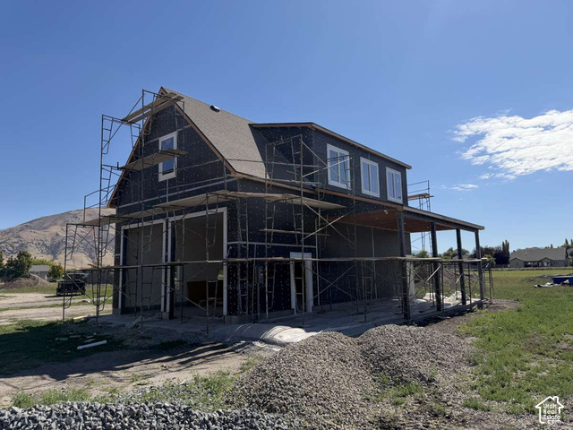 338 West 3400 South Logan, UT 84321 - Photo 33 of 40 Two-story structure with a gabled roof and covered side patio