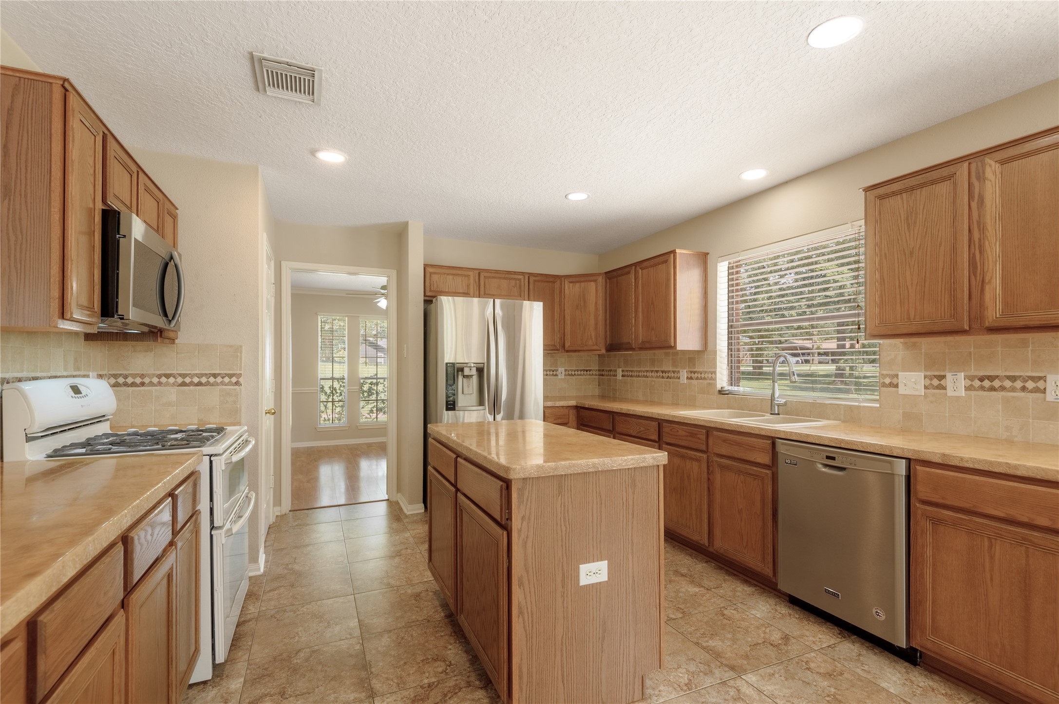 324 Red Oak Lane Trinity, TX 75862 - Photo 21 of 49 a kitchen with sink stove and cabinets