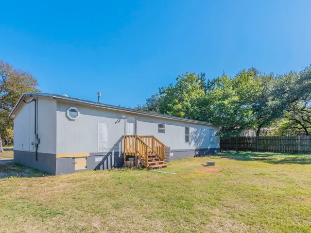 a view of a backyard with a trampoline