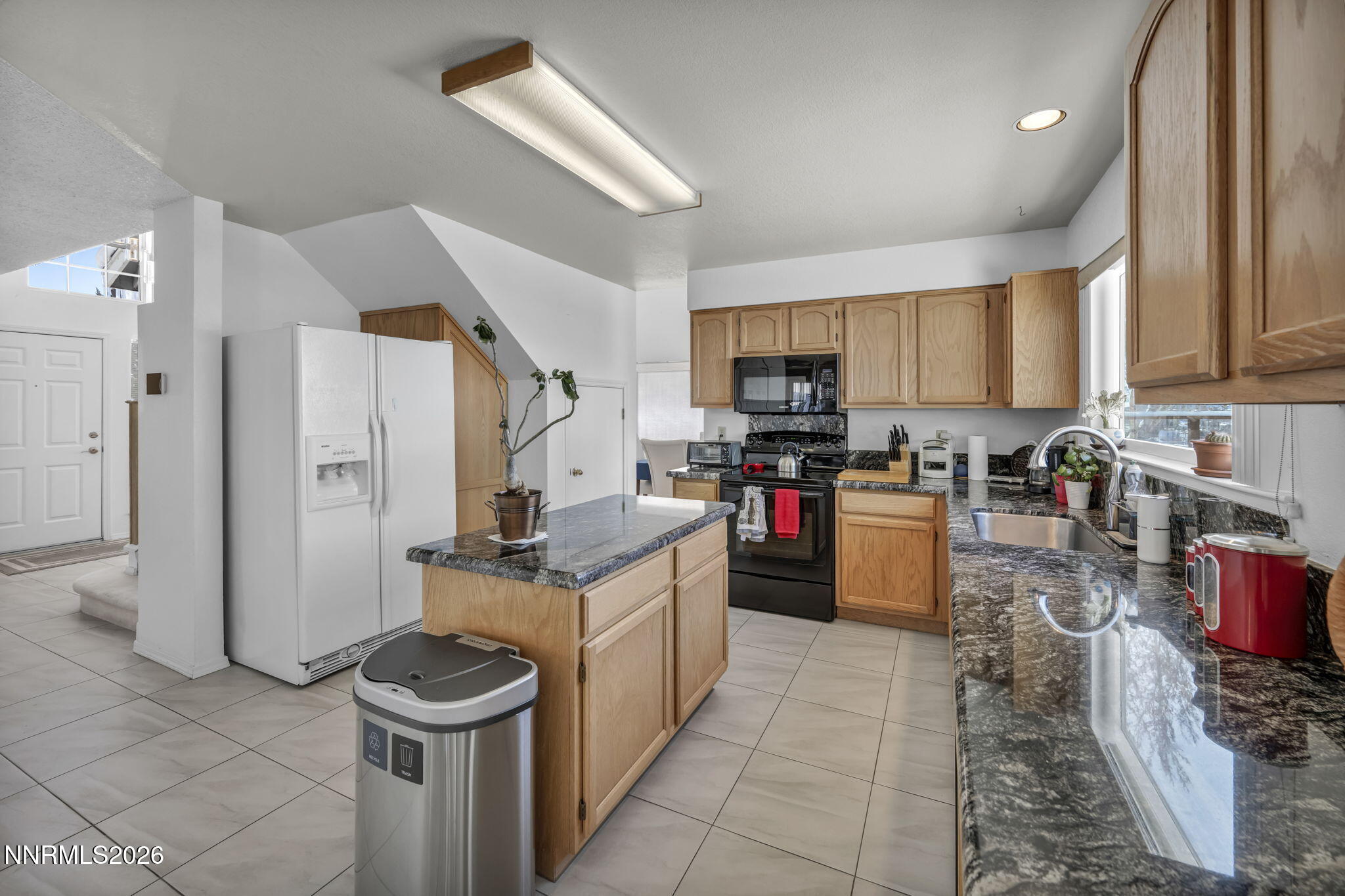 4692 Canyon Ridge Lane Reno, NV 89523 - Photo 39 of 68 a kitchen with stainless steel appliances granite countertop a stove top oven a sink dishwasher and a refrigerator