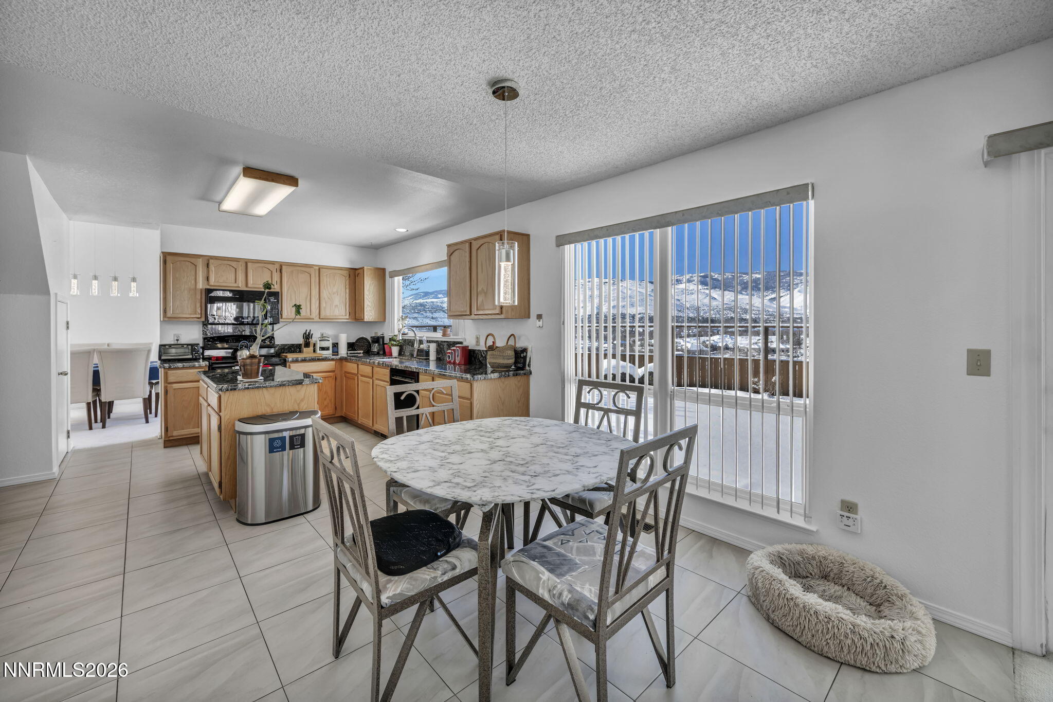 4692 Canyon Ridge Lane Reno, NV 89523 - Photo 47 of 68 a view of a dining room with furniture window and outside view
