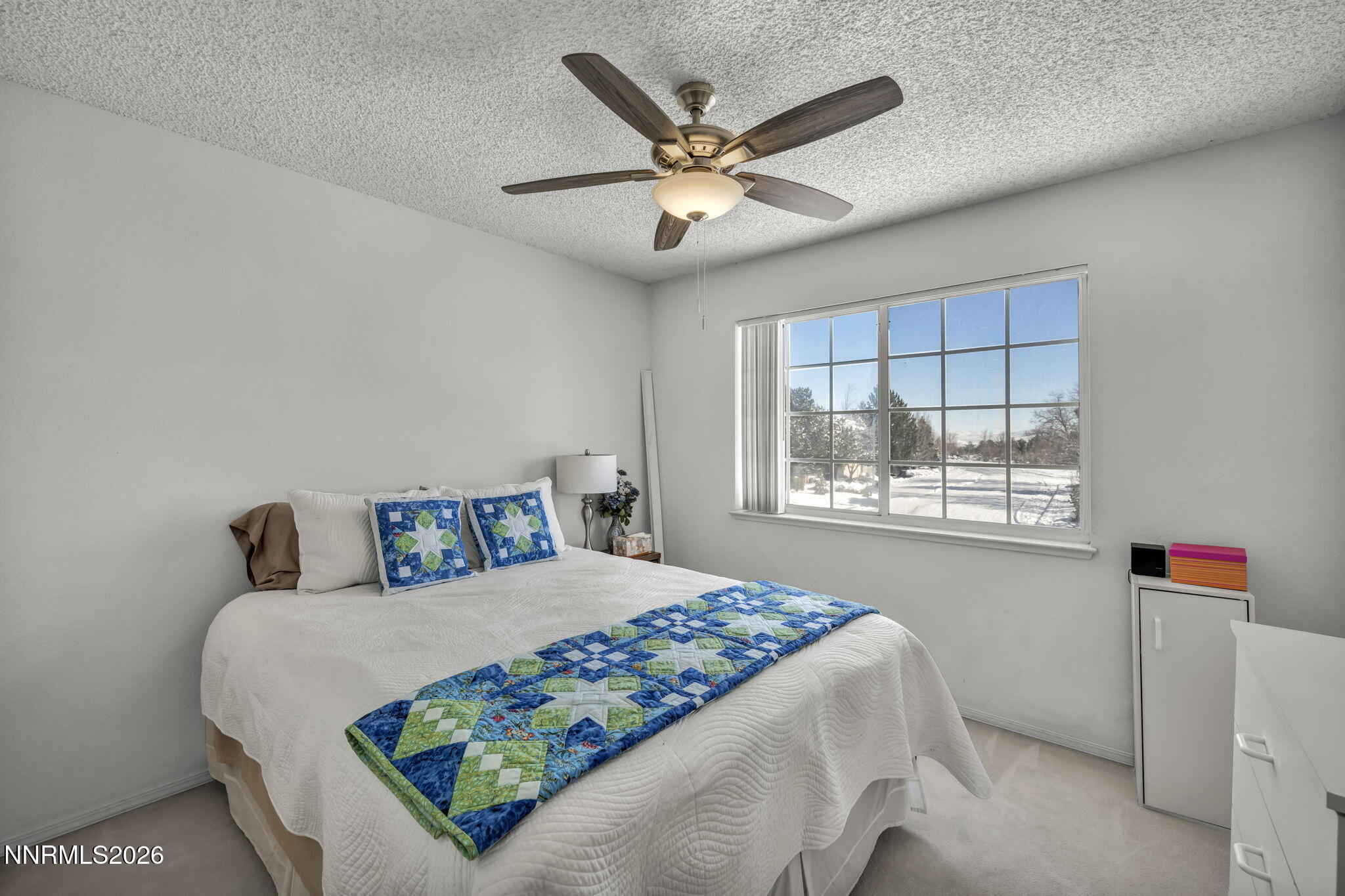4692 Canyon Ridge Lane Reno, NV 89523 - Photo 49 of 68 a bedroom with a bed and window with a flat screen tv