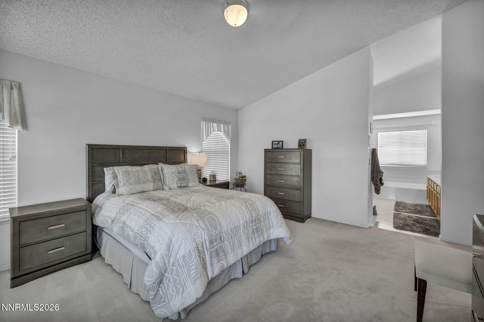 4692 Canyon Ridge Lane Reno, NV 89523 - Photo 52 of 68 a bedroom with a bed and a lamp on dresser