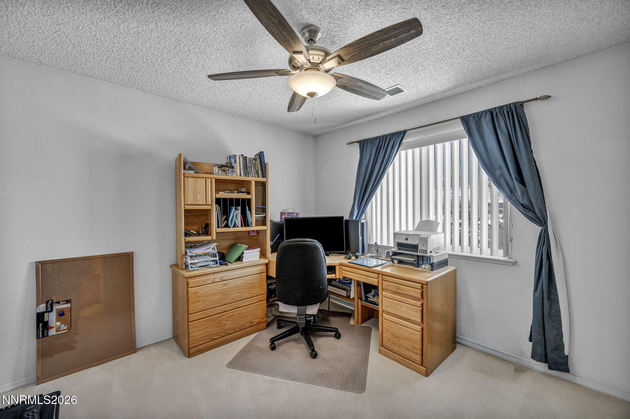 4692 Canyon Ridge Lane Reno, NV 89523 - Photo 55 of 68 a view of a workspace with furniture and a window