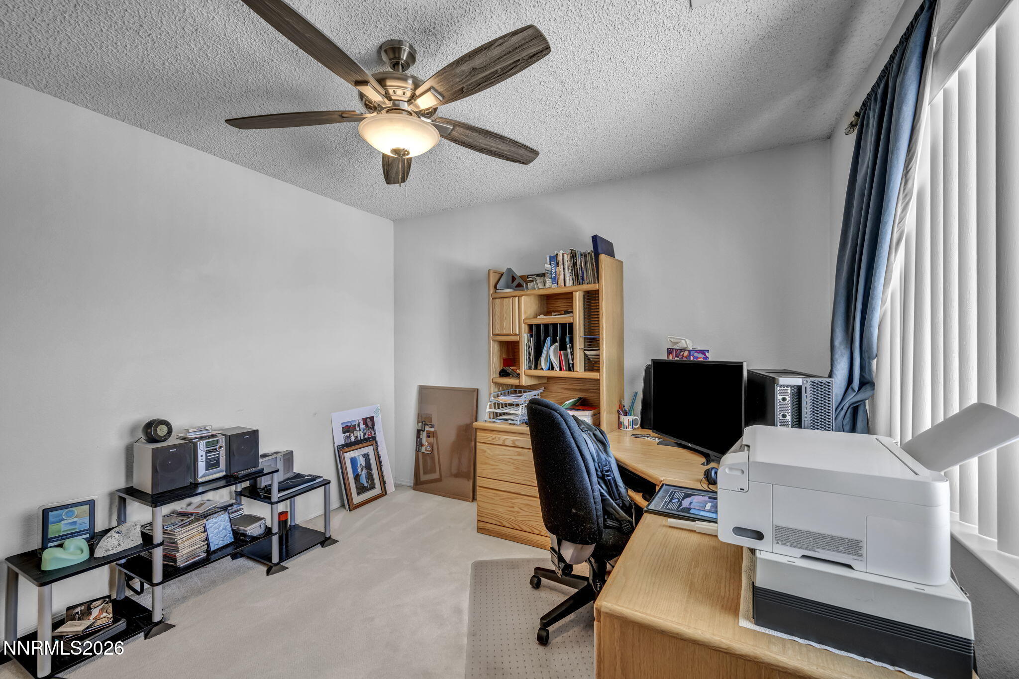 4692 Canyon Ridge Lane Reno, NV 89523 - Photo 56 of 68 a view of a workspace with furniture and a window
