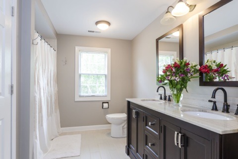 737 West Bauer Road Naperville, IL 60563 - Photo 17 of 25 a bathroom with a granite countertop sink a large mirror and a toilet