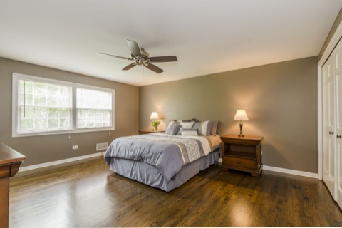 737 West Bauer Road Naperville, IL 60563 - Photo 18 of 25 a bedroom with a bed and a window