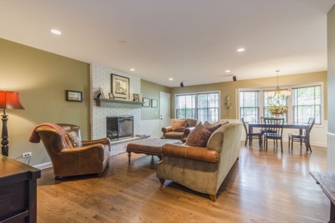 737 West Bauer Road Naperville, IL 60563 - Photo 3 of 25 a living room with furniture a fireplace a rug and a large window