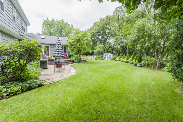 737 West Bauer Road Naperville, IL 60563 - Photo 23 of 25 a view of a chair and table in backyard of the house