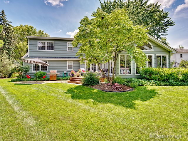 737 West Bauer Road Naperville, IL 60563 - Photo 25 of 25 a front view of a house with a garden and plants