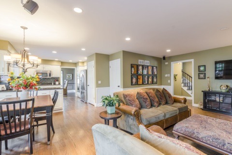 737 West Bauer Road Naperville, IL 60563 - Photo 4 of 25 a living room with furniture and a flat screen tv